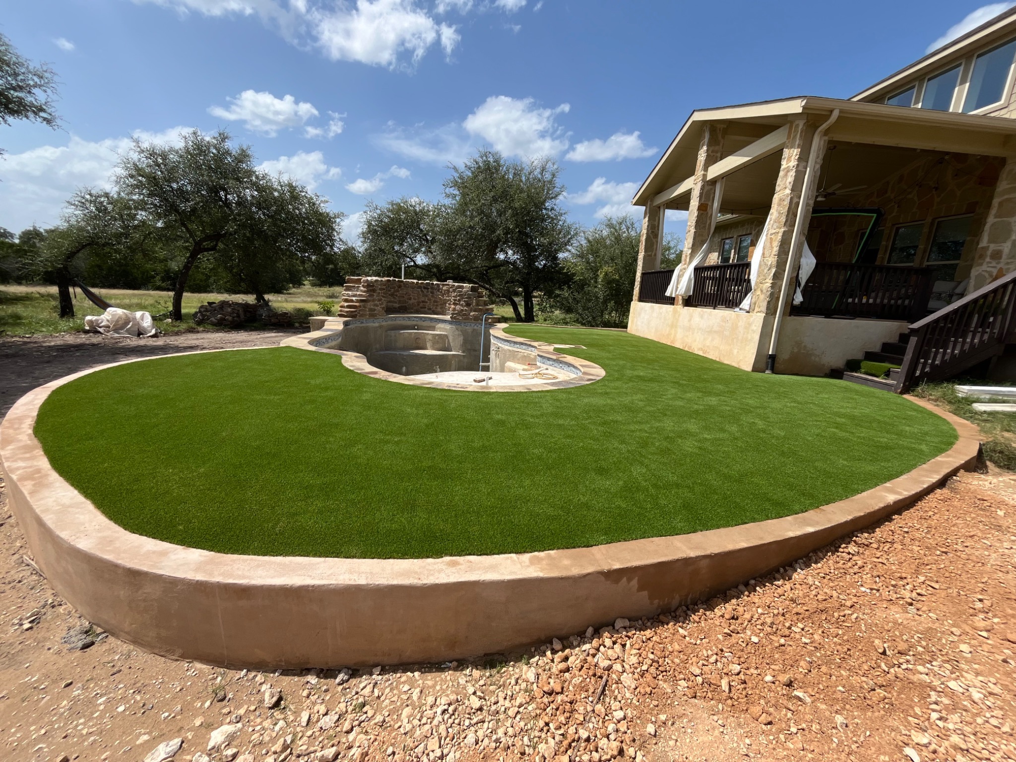 Curved poolside turf installation